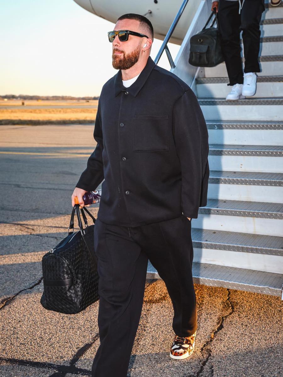 Travis Kelce: Tom Ford Sunglasses, Black Overshirt + Trackpants & Animal Print Sneakers