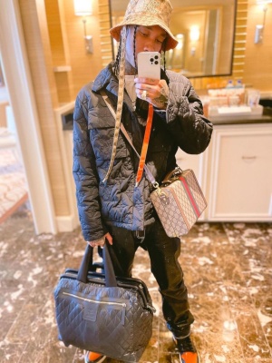 Tyga Wearing A Gucci X Tnf Hat With A Louis Vuitton Jacket Gucci Bag Chanel Bag And Patent Jordans