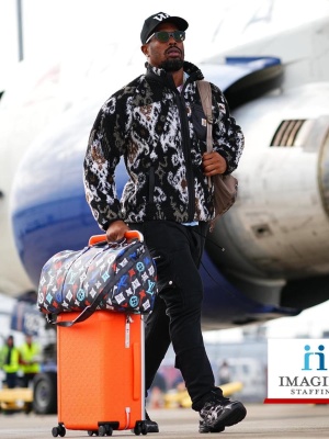 Von Miller Wearing A Carhartt Fleece Jacket With Amiri Cargo Sweatpants Louis Vuitton Duffle Suitcase And Asics Sneakers