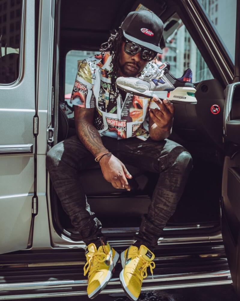 Wale in an Off-White Hat, High Times Shirt, & Nike SB's