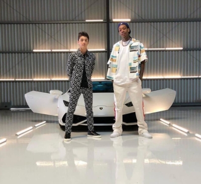 Wiz Khalifa Next To A White Lamborghini Aventador In Calvin Klein