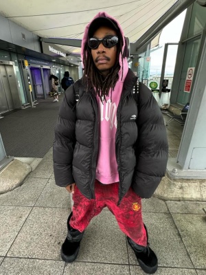 Wiz Khalifa Wearing A Balenciaga Puffer Pink Hoodie Graffiti Sweatpants And Boots Outfit