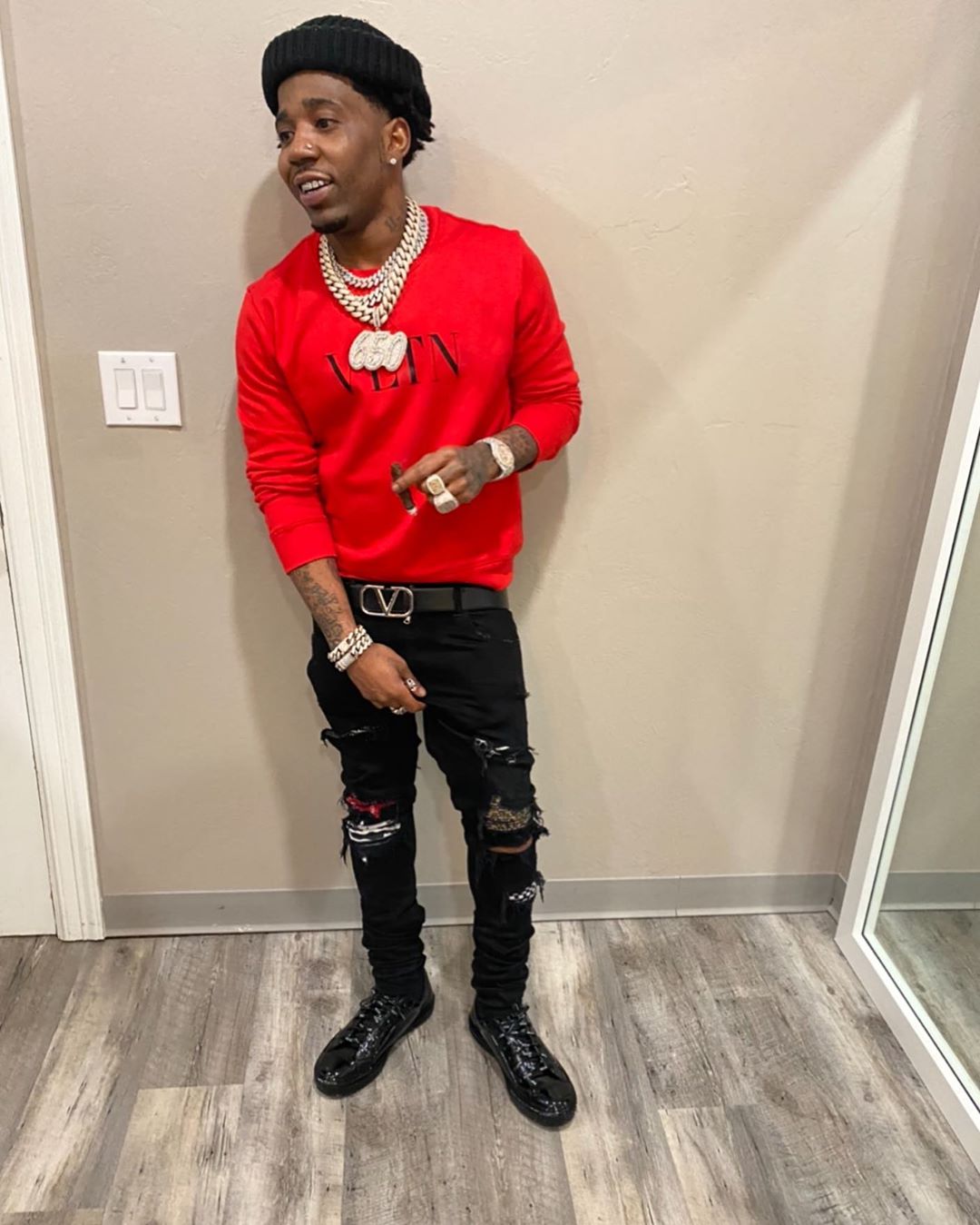 YFN Lucci wearing a Valentino Red Crewneck Sweatshirt with a Black ...