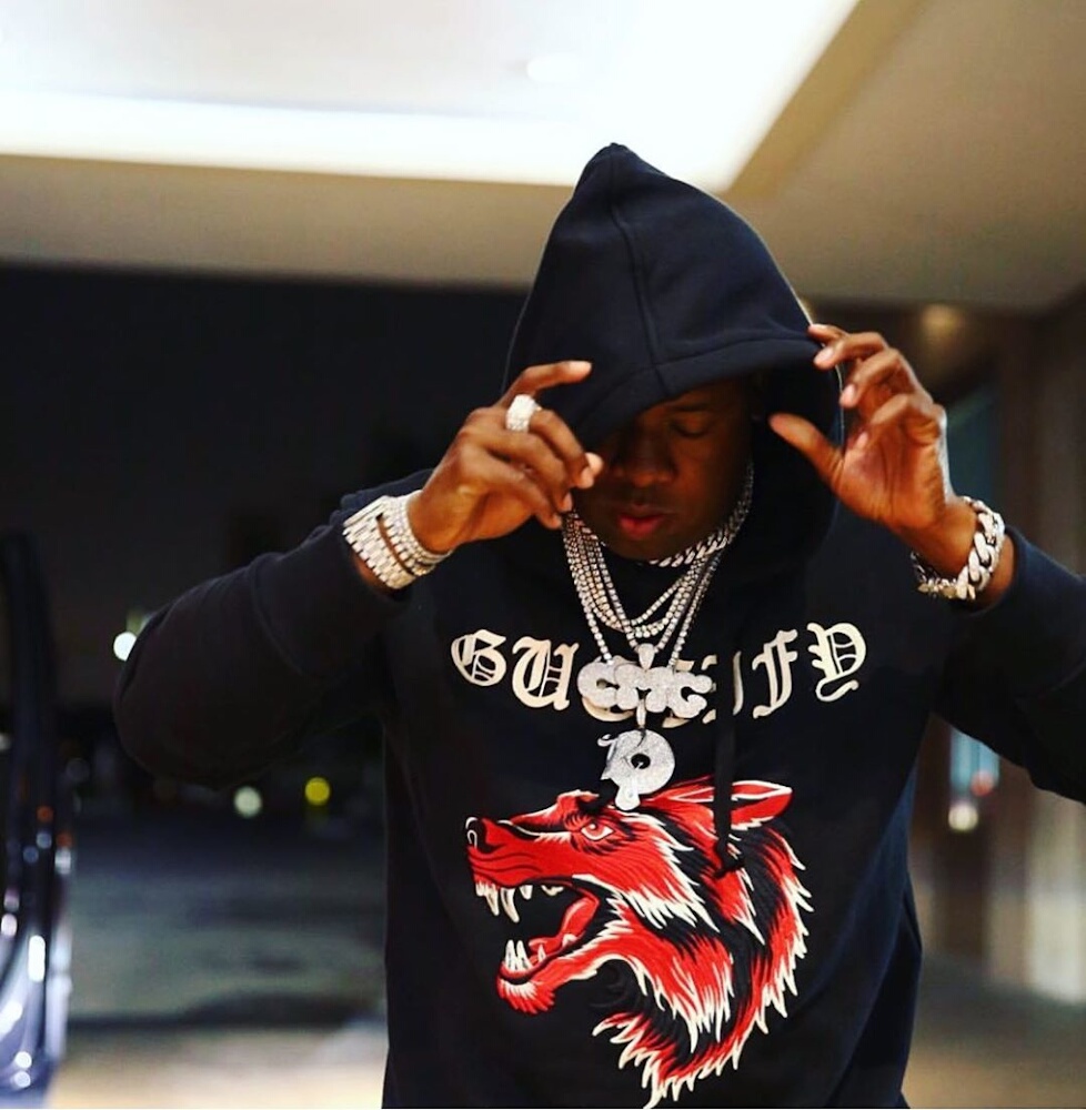Yo Gotti Poses For A Photo Wearing a Gucci Wolf Hoodie