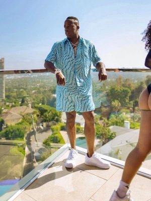 Yo Gotti Wearing A Blue And White Fendi Outfit With White Nike Air Force 1 Sneakers