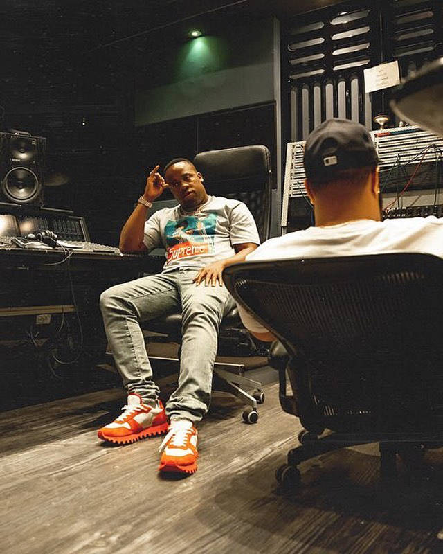 Yo Gotti In The Studio Wearing a Supreme Shirt & Louis Vuitton Sneakers