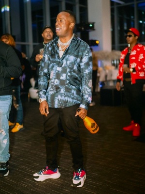 Yoo Gotti Wearing A Louis Vuitton Salt Monogram Shirt With Black Jeans And Dior B22 Sneakers
