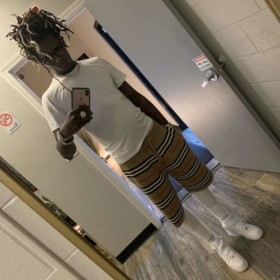 Young Thug Wearing A White Tee And Burberry Shorts