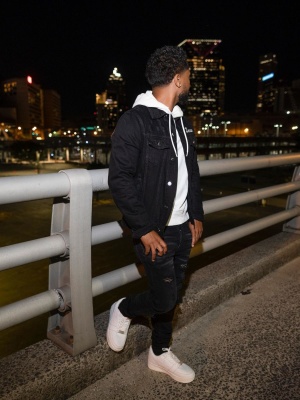 Zaytoven Wearing An Amiri Black Denim Lover Jacket With Camo Mx1 Jeans And Bape Sneakers